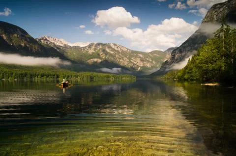 Fishing in an alpine lake Stock Photos