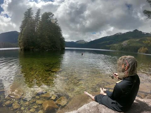 Fishing and avoiding mosquitos Stock-Fotos
