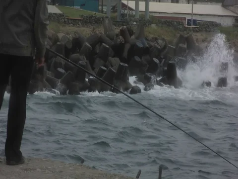 Fishing and restless sea Stock Footage 80671961