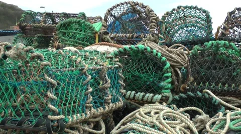 Fishing baskets nets ropes working colorful quayside Stock Footage 49197133
