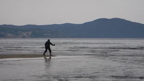 Fishing from the beach 4147 Stock Footage 106828958