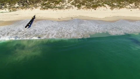 Fishing on a beach near storm drain aerial footage - Perth, Australia Stock Footage 106984153