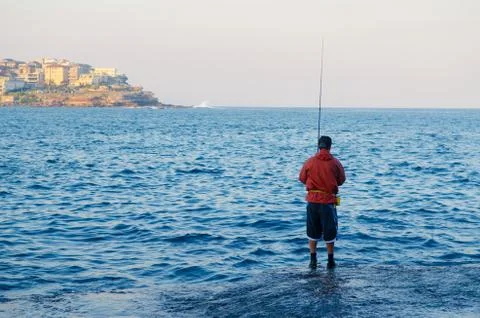Fishing at beach Stock Photos
