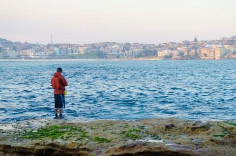 Fishing at beach Stock Photos