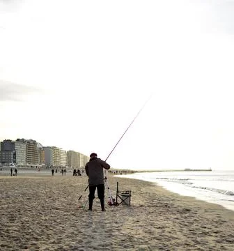 Fishing from the beach Stock Photos