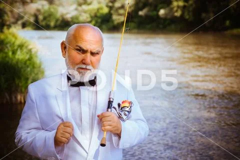 Fishing became a popular recreational activity. Fly fishing. Fly fisherman using Stock Photos
