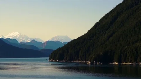 Fishing Boat Alongside Alaskan Mountains Stock Footage