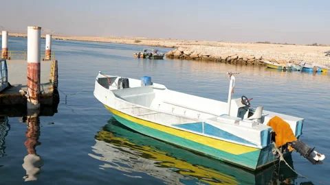 Fishing boat anchored to the peer Stock Footage 171864166