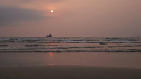 Fishing boat and rolling waves at sunset on Da Nang Beach, Vietnam Stock-Footage 291675583