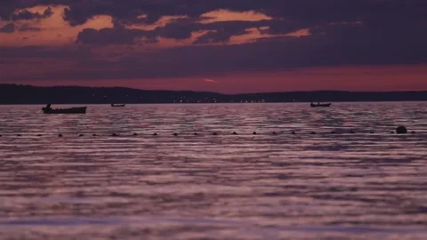 Fishing boat on a background of pink sunset. Stock Footage 137788310