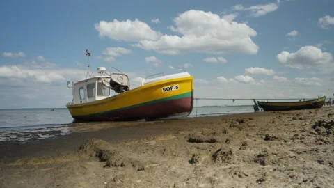 Fishing Boat On a Beach Video stock 132216130