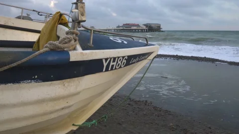 Fishing boat on the beach Video stock 208953859
