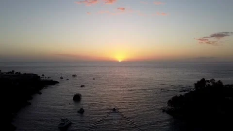 Fishing boat chasing the sunset over the horizon in Kauai Stock Footage 260586951