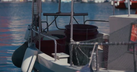 Fishing boat deck with buckets and netting in marina Stock-Footage 334338914