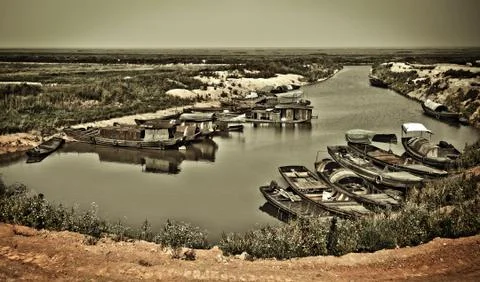 Fishing boat docked in the river Stock Photos