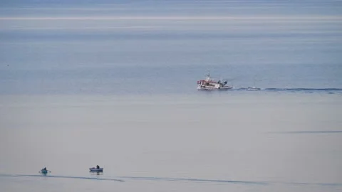 Fishing boat dragging a smaller one Video stock 156167853