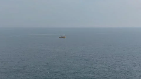 Fishing boat floating on calm open sea aerial view Video stock 321121352