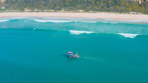 Fishing Boat Floating on Ocean Waves Near Shore Stock Footage 105197335