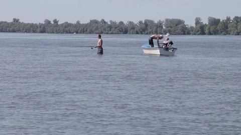 Fishing by the boat Stock Footage 78137658