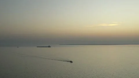 Fishing Boat with Large Catch Fish Swirling Flock Gulls Aerial View Drone Sunset Stock Footage 224777862