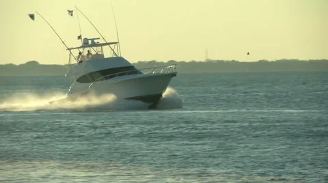 Fishing boat navigating fast at the sunset  Video stock 43319180