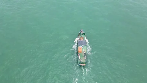 Fishing boat navigating in turquoise waters Stock Footage 330278086