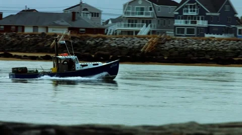 Fishing Boat in the Ocean at the Beach During The Winter Stock Footage 45369366