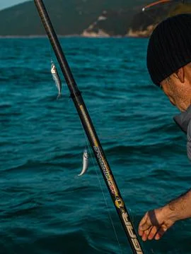 Fishing on a boat Stock Photos