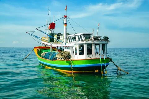 A fishing boat is pulling up on the beach Stock-Fotos