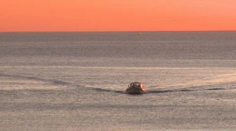 Fishing boat return at sunset Stock Footage 319086