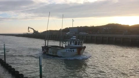 Fishing boat returning at sunset, slow motion. Video stock 226199778