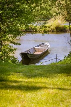 Fishing boat on the river Stock Photos