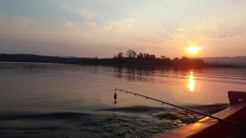 Fishing boat on the river at sunset. Stock Footage 129213987