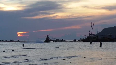A fishing boat sails in the sunset Stock Footage 71763233
