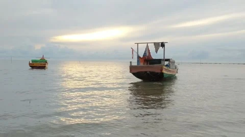 Fishing boat on the seashore Stock Footage 240306220
