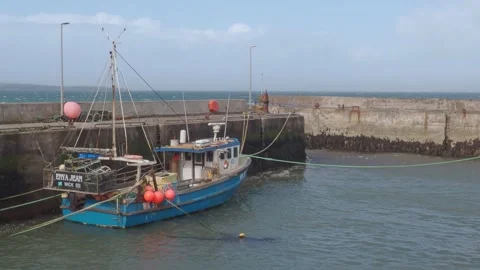 Fishing Boat Tossed by Waves in John O'Groats Harbour on a Rough Day Stock Footage 332070169