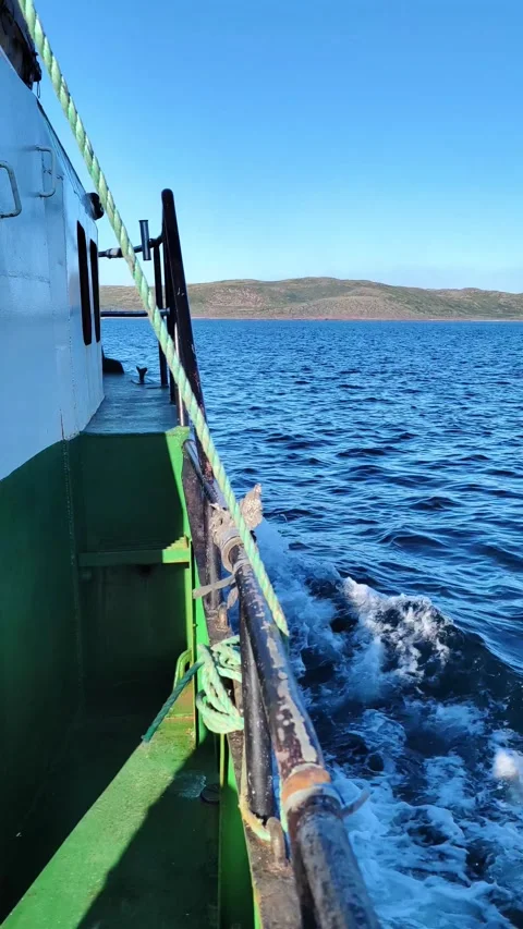 Fishing boat trawler catch fish and sailing on sea. Ship is sailing. Stock Footage 296226213
