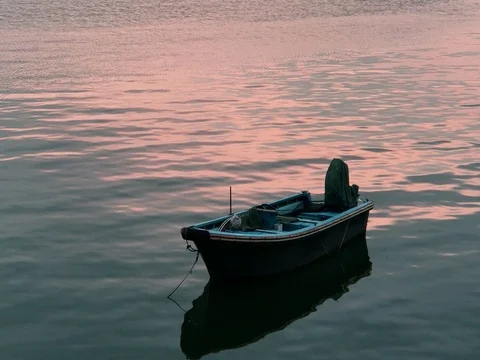 Fishing boat with water reflection and wave on the lake Video stock 73592158