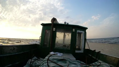 Fishing boat while sunset after work 動画素材 121683103