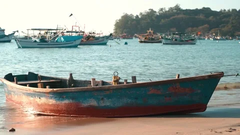 Fishing boats on the beach waves Stock Footage 138539699