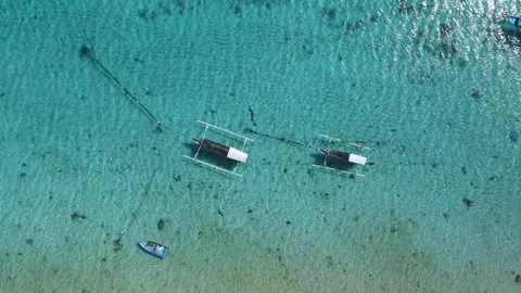 Fishing boats in blue ocean on Bali isla... Stock Video Pond5