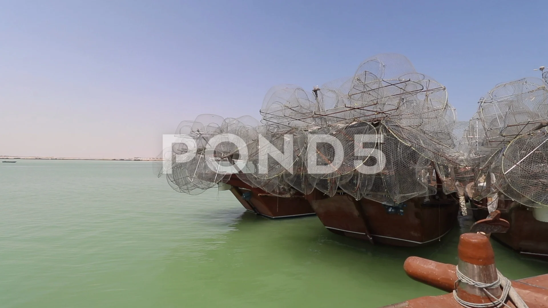 Fishing boats in Doha Qatar lined up wit... | Stock Video | Pond5