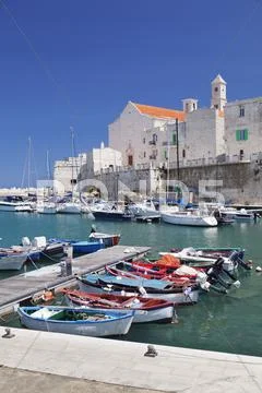 Fishing boats at the harbour, old town with cathedral, Giovinazzo, Bari Stock Photos