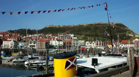 Fishing boats in the harbour at Scarborough North Yorkshire Stock Footage