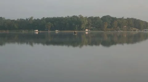 Fishing boats on lake Stock Footage 12425130