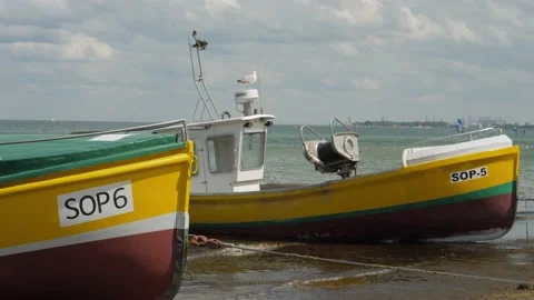 Fishing Boats Moored On The Beach Stock Footage 132215869