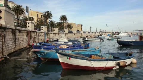 Fishing boats moored in the harbor of Bari, Italy Stock Footage
