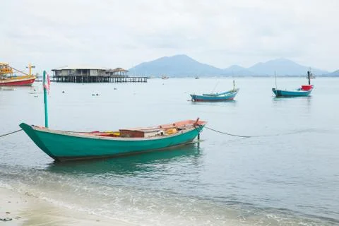 Fishing boats moored at the shore. Stock Photos
