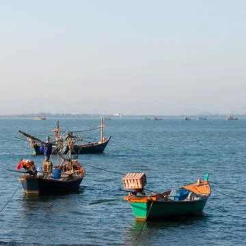 Fishing boats near the seashore Stock Photos