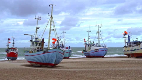Fishing boats pulled ashore before the arrival of a late summer storm Stock Footage 162256314